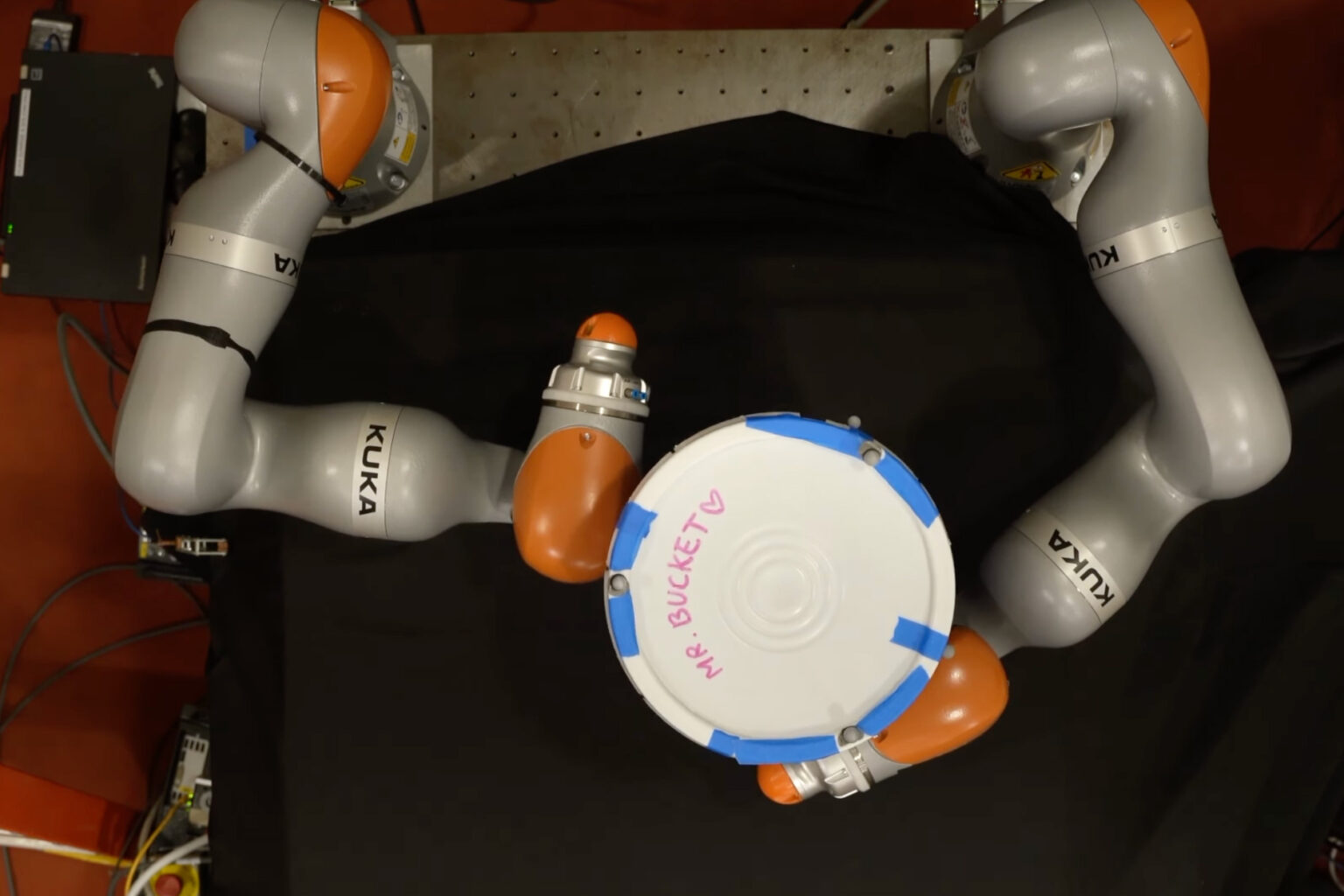 AI helps robots manipulate objects with their whole bodies | MIT News