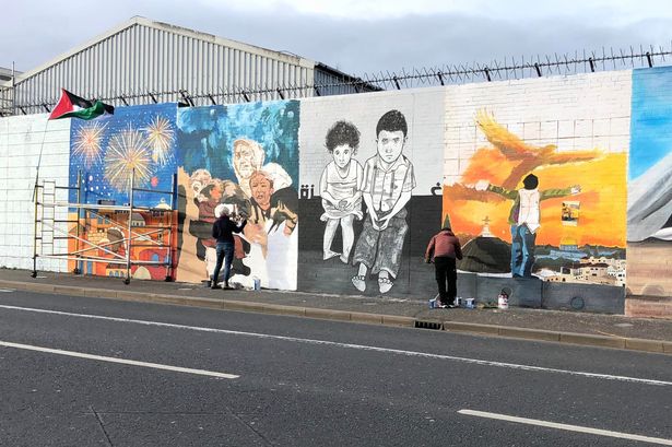 Belfast artists covering famous International Wall at Divis in murals for Palestine