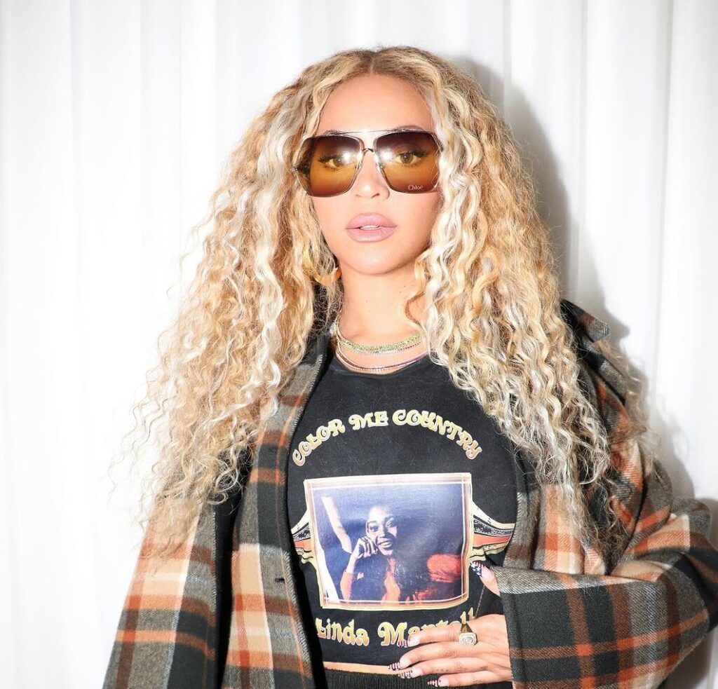 Beyoncé Spotlights Cowboy Carter in Chloe’s Oversized Plaid Cape and Linda Martell’s Color Me Country Tee, Now at Fashion Bomb Daily Shop!