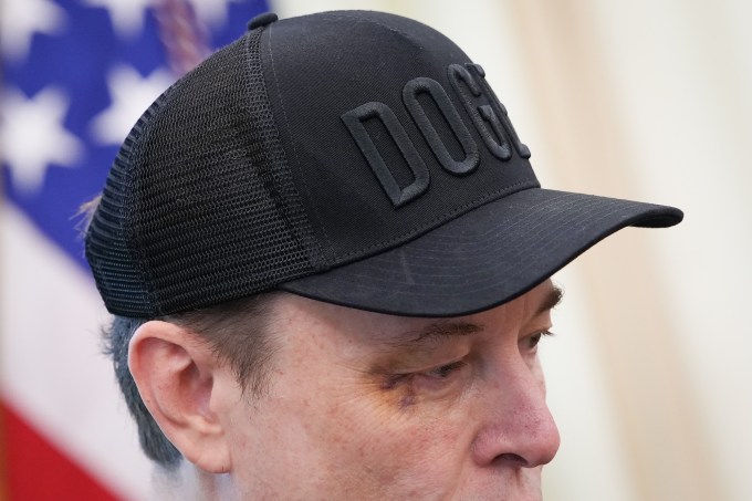 Tesla CEO Elon Musk, with a visible black eye, listens as U.S. President Donald Trump speaks to reporters in the Oval Office of the White House on May 30, 2025