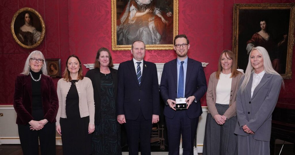 Family of 21-year-old paramedic who died in ambulance crash honoured by the King