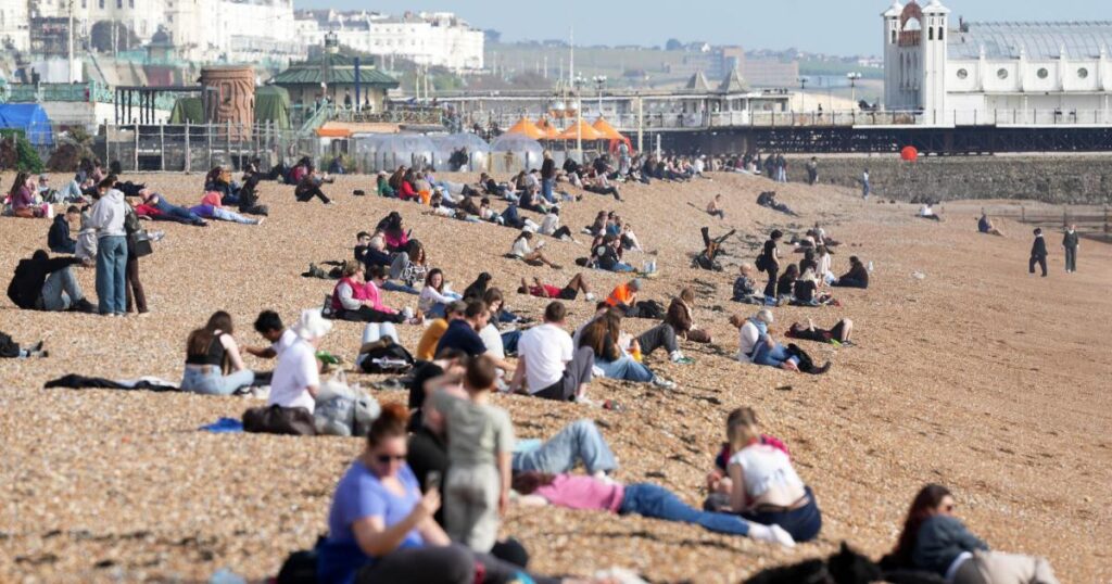 Sunseekers flock to Brighton beach to enjoy spring sunshine