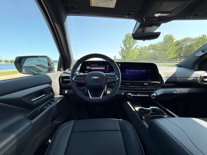 A screen shows 80% inside an electric pickup truck.
