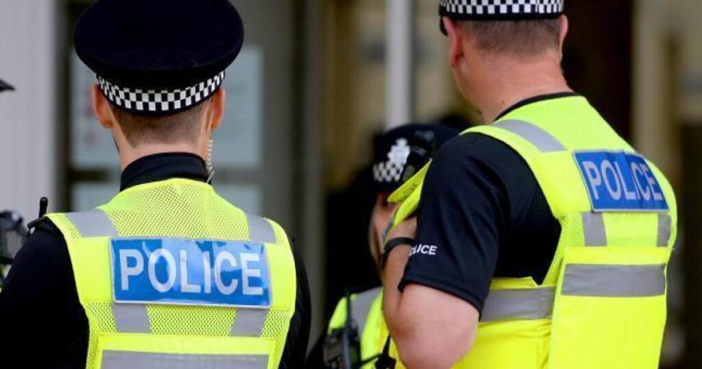 Cops attend scene after crowd gathers outside property