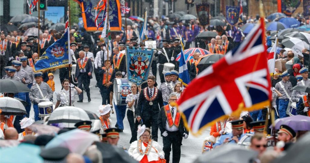 Two arrested as 11,000 march in Glasgow’s biggest Orange Walk