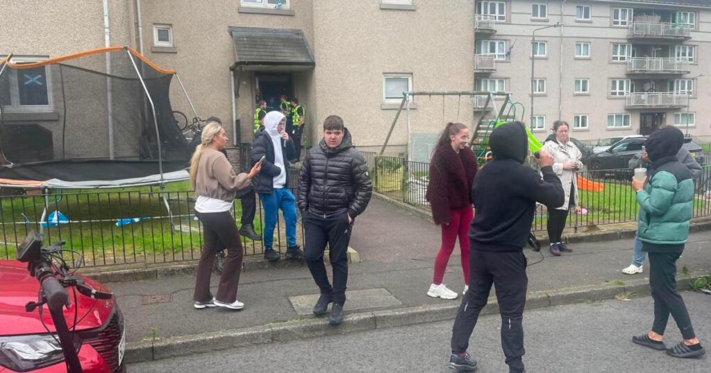 LIVE updates as two men removed from Glasgow property amid police guard